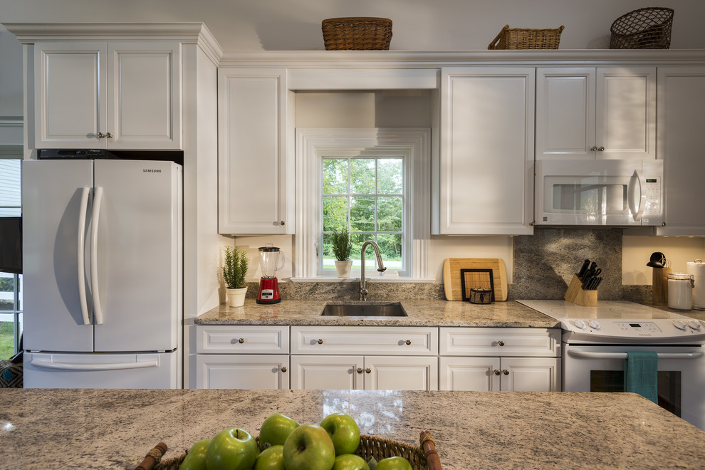 Inspiration for a timeless eat-in kitchen remodel in New York with an undermount sink, beaded inset cabinets, white cabinets, granite countertops and white appliances