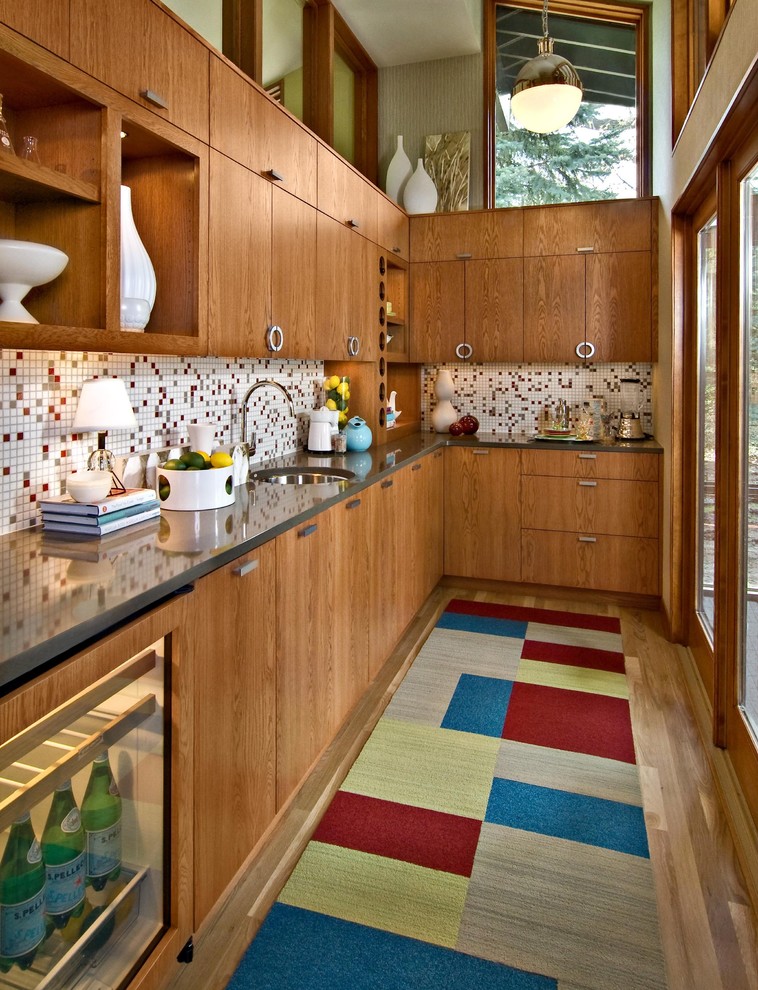 Enclosed kitchen - 1960s enclosed kitchen idea in Minneapolis with mosaic tile backsplash, multicolored backsplash, flat-panel cabinets and medium tone wood cabinets