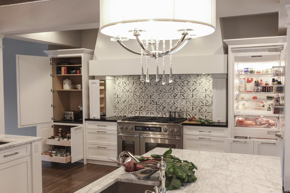 Design ideas for a large traditional u-shaped open plan kitchen in DC Metro with a submerged sink, recessed-panel cabinets, black cabinets, marble worktops, grey splashback, mosaic tiled splashback, stainless steel appliances, dark hardwood flooring and multiple islands.