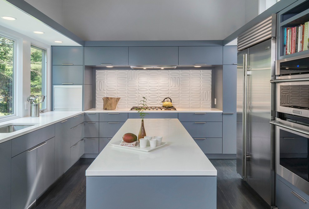 Photo of a medium sized retro u-shaped enclosed kitchen in Boston with flat-panel cabinets, stainless steel appliances, grey cabinets, white splashback, ceramic splashback, a submerged sink, quartz worktops and dark hardwood flooring.