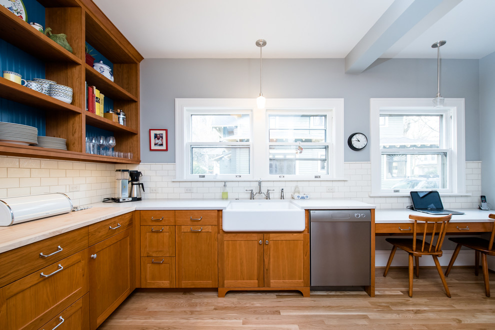 Example of an arts and crafts eat-in kitchen design in Portland with open cabinets, light wood cabinets, marble countertops, white backsplash, ceramic backsplash and stainless steel appliances