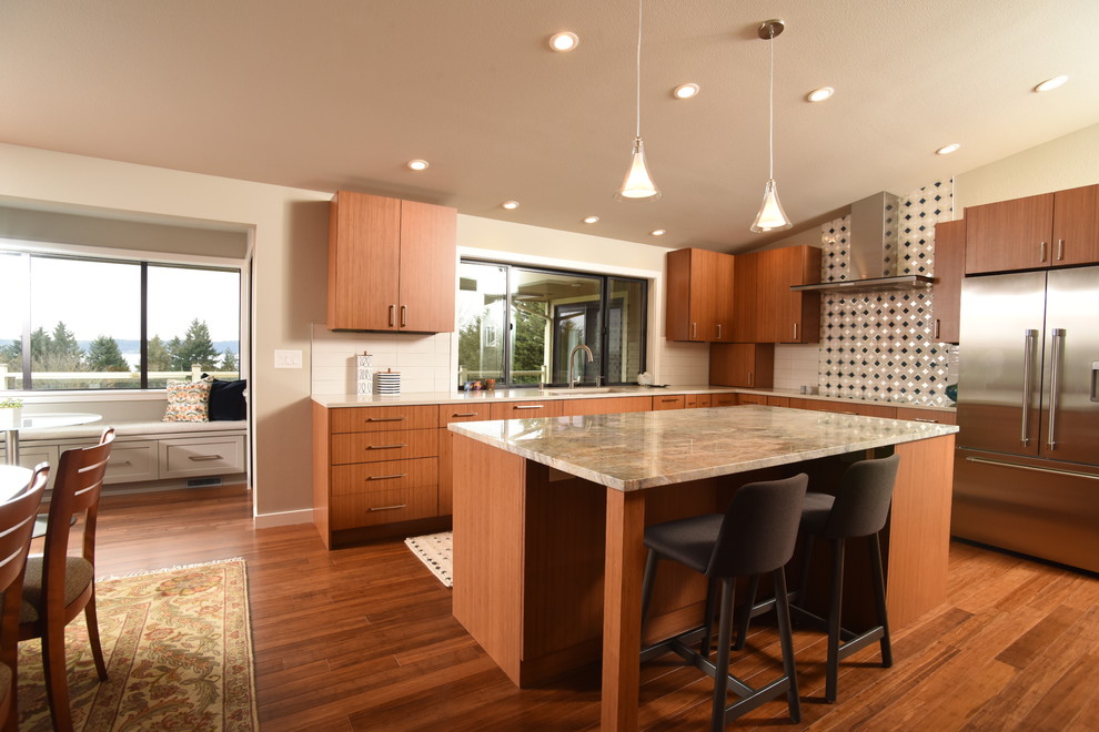Inspiration for a mid-century modern l-shaped medium tone wood floor eat-in kitchen remodel in Seattle with an undermount sink, flat-panel cabinets, medium tone wood cabinets, metallic backsplash, stainless steel appliances and an island