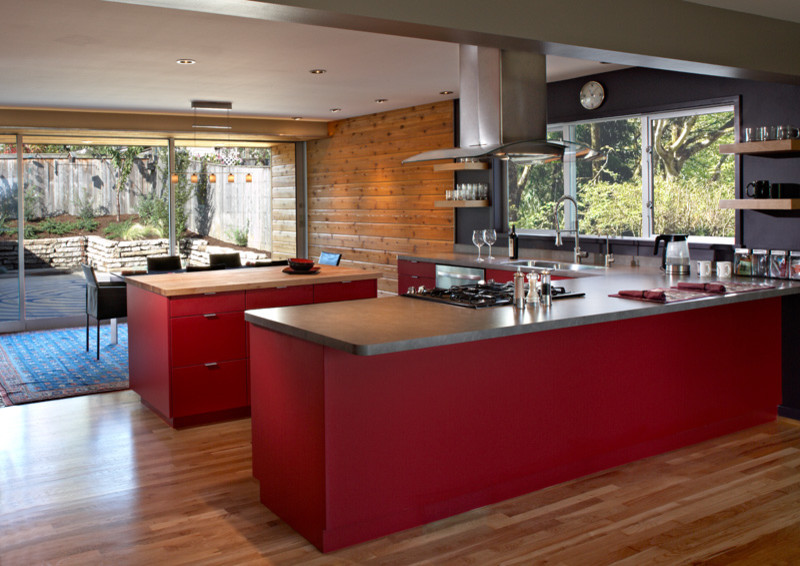 Design ideas for a midcentury kitchen in Portland with red cabinets.