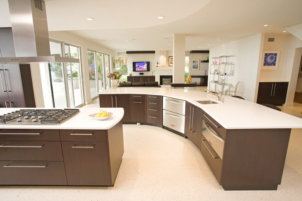 Open concept kitchen - mid-sized modern l-shaped terrazzo floor open concept kitchen idea in Tampa with an undermount sink, flat-panel cabinets, dark wood cabinets, quartz countertops, white backsplash, paneled appliances and two islands
