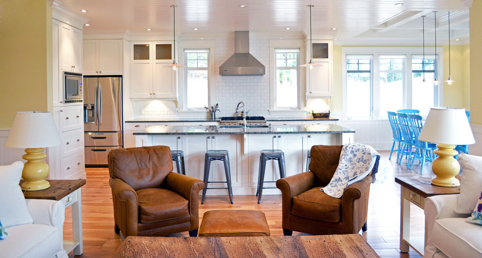 Cottage open concept kitchen photo in Vancouver with white backsplash, subway tile backsplash and stainless steel appliances