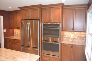 Custom, in-cabinet dish drying rack. Water drips directly into the sink. -  Transitional - Kitchen - Seattle - by Genay Bell Interior Design