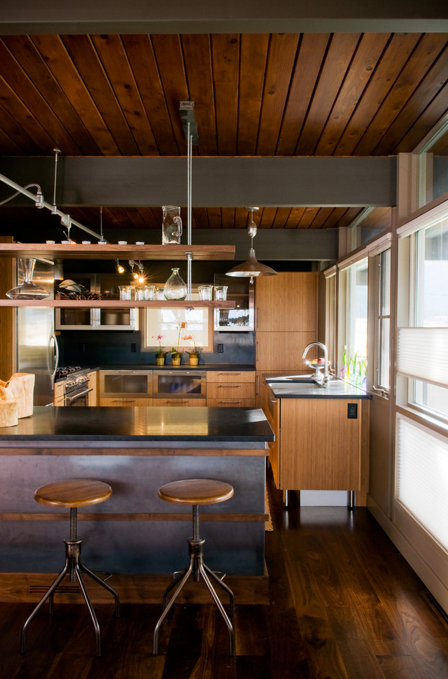 Photo of a midcentury enclosed kitchen in Other with stainless steel appliances.
