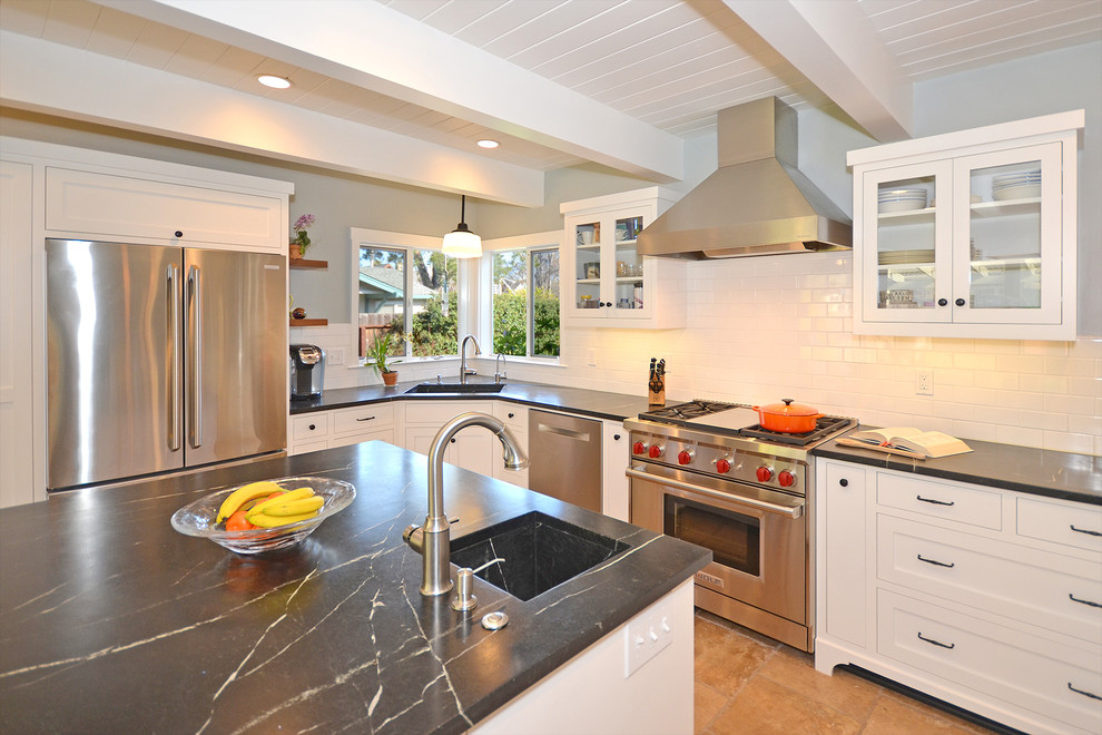 Enclosed kitchen - mid-sized 1950s u-shaped terra-cotta tile enclosed kitchen idea in San Francisco with a single-bowl sink, shaker cabinets, white cabinets, marble countertops, white backsplash, ceramic backsplash, stainless steel appliances and an island