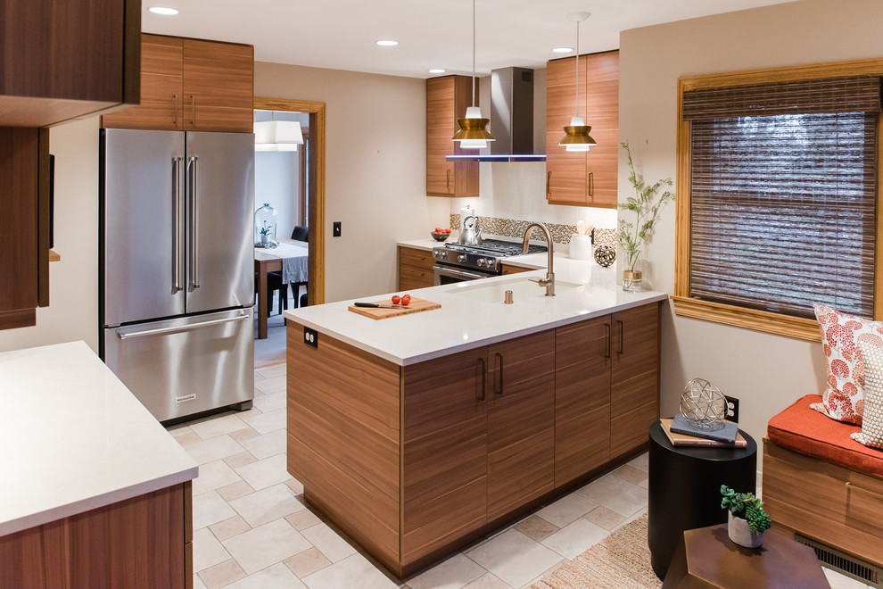 Enclosed kitchen - mid-sized 1960s l-shaped ceramic tile and beige floor enclosed kitchen idea in Minneapolis with an undermount sink, flat-panel cabinets, medium tone wood cabinets, quartz countertops, gray backsplash, subway tile backsplash, stainless steel appliances and a peninsula