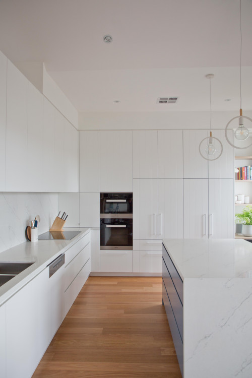 Modern Simplicity: White Kitchen Cabinets with a Wooden Floor
