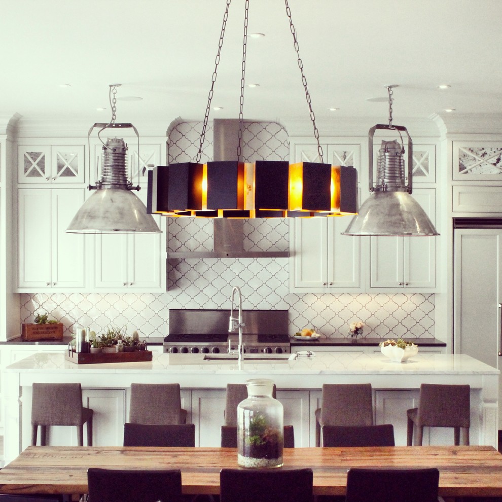 Eat-in kitchen - contemporary eat-in kitchen idea in Atlanta with recessed-panel cabinets, white cabinets, marble countertops, white backsplash, stainless steel appliances and an island