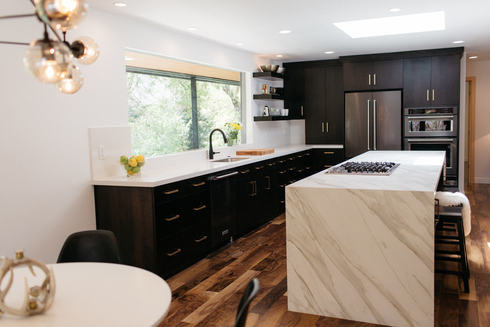 Mid-sized trendy l-shaped dark wood floor and brown floor eat-in kitchen photo in Salt Lake City with a single-bowl sink, flat-panel cabinets, dark wood cabinets, quartzite countertops, stainless steel appliances and an island