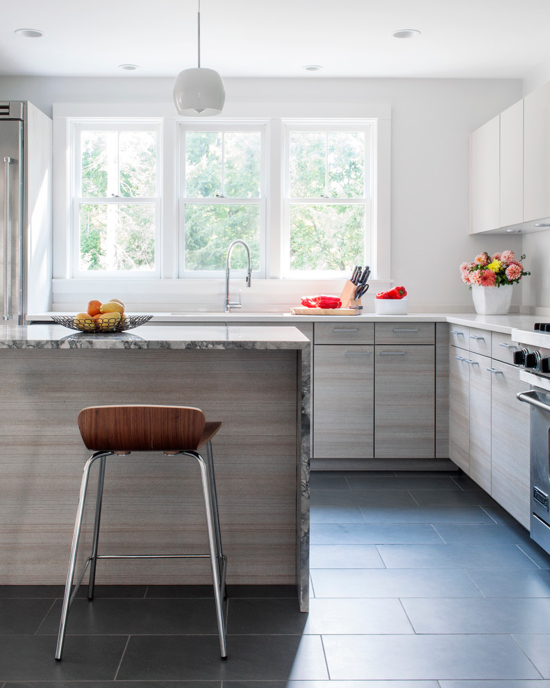 Modern kitchen in Boston with flat-panel cabinets.