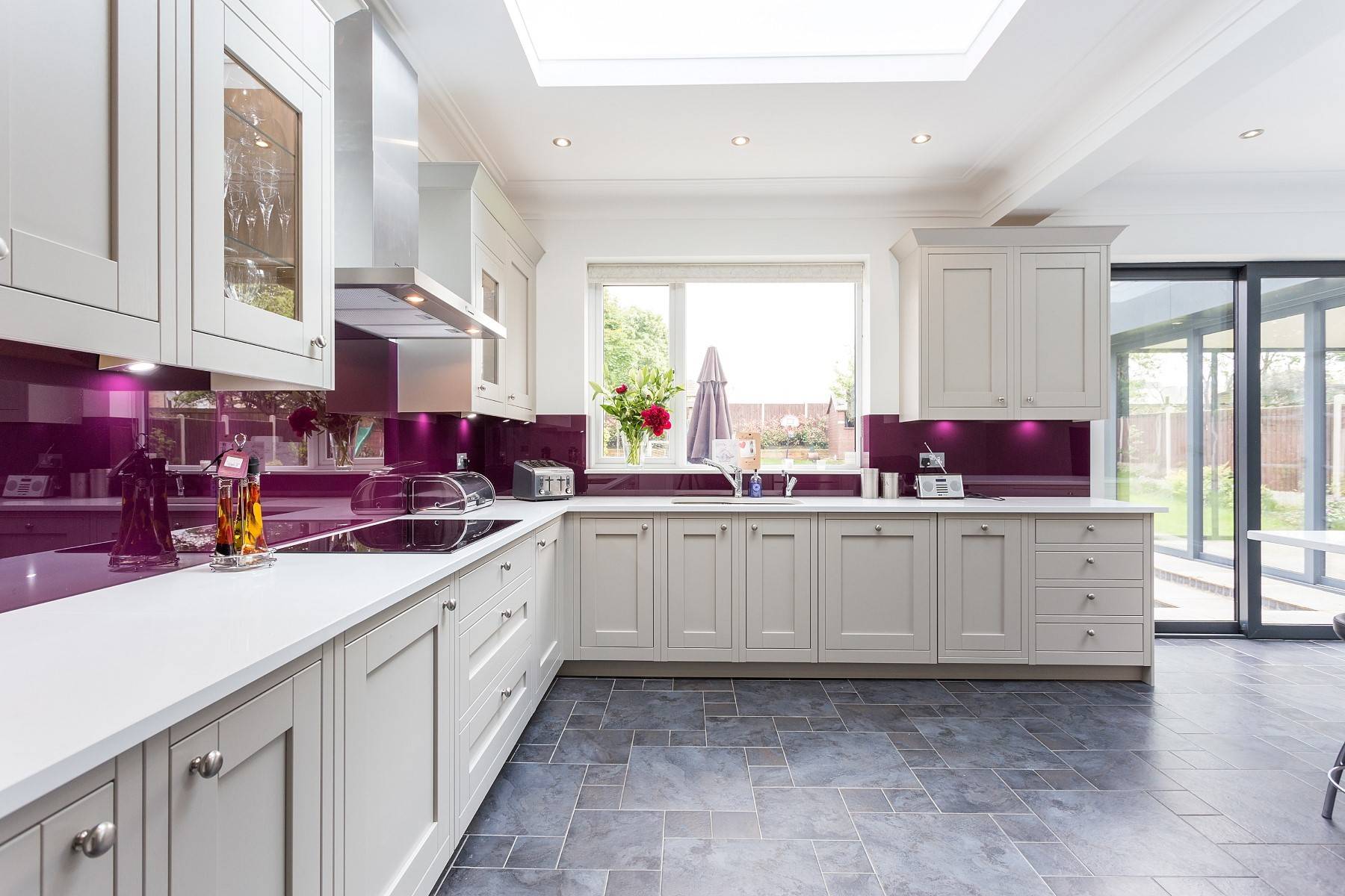 Milton In Frame Kitchen With Aubergine Glass Splash Backs Kitchen London By C C Kitchens Houzz