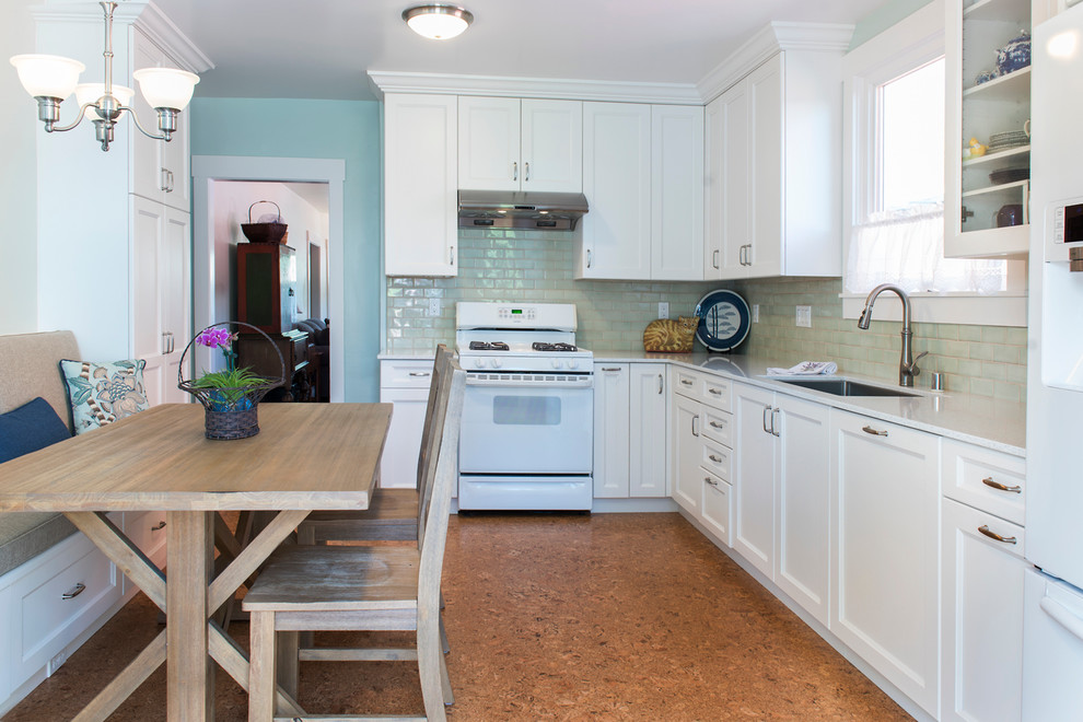Example of a mid-sized classic l-shaped cork floor and beige floor enclosed kitchen design in San Francisco with an undermount sink, recessed-panel cabinets, white cabinets, quartz countertops, green backsplash, ceramic backsplash, white appliances and no island