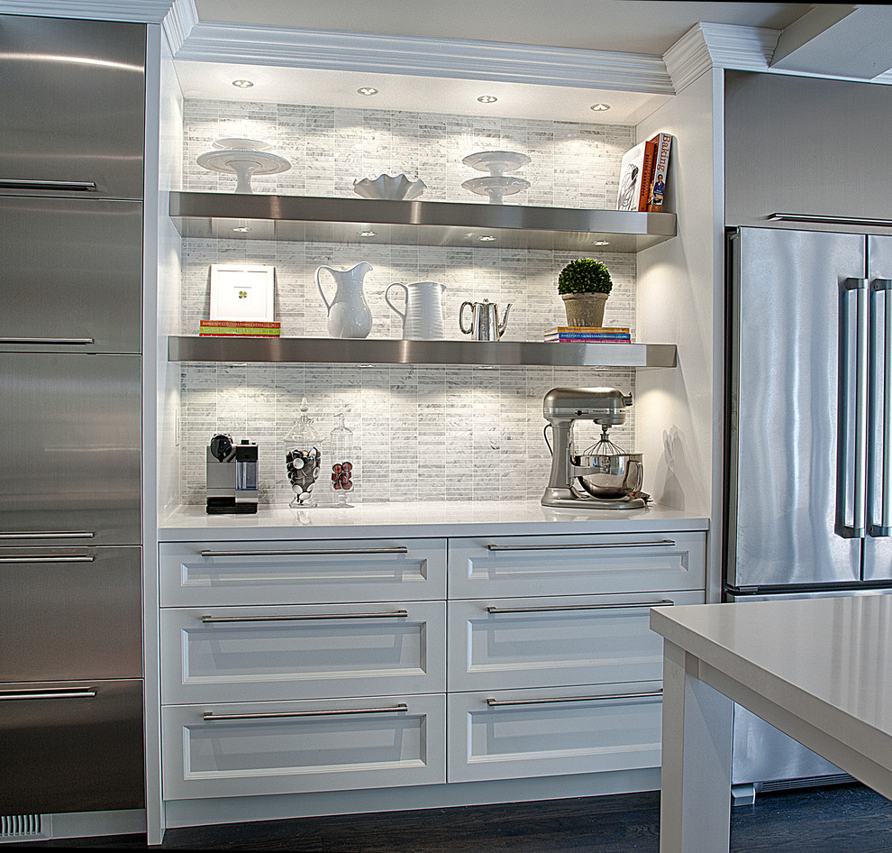 This is an example of a large contemporary single-wall kitchen pantry in Toronto with a submerged sink, white cabinets, engineered stone countertops, grey splashback, stone tiled splashback, stainless steel appliances, dark hardwood flooring and an island.