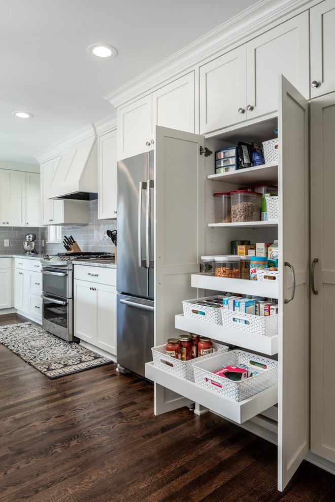 Inspiration for a medium sized traditional kitchen pantry in Minneapolis with a submerged sink, shaker cabinets, white cabinets, granite worktops, grey splashback, metro tiled splashback, stainless steel appliances and dark hardwood flooring.