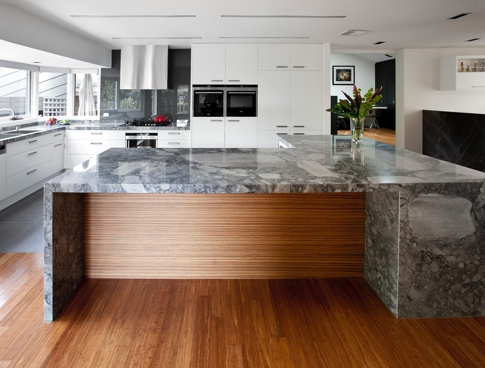Contemporary kitchen in Melbourne with stainless steel appliances.