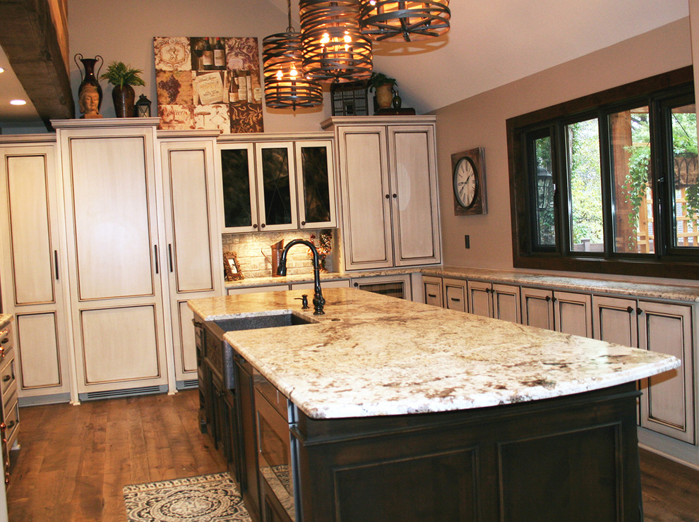 Inspiration for a traditional kitchen in Kansas City with granite worktops and an island.