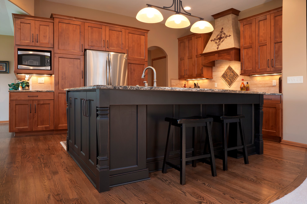 This is an example of a kitchen in Wichita with flat-panel cabinets.