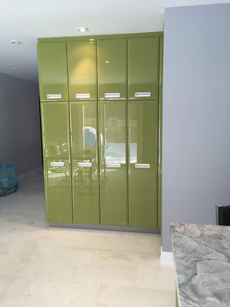 Photo of a large contemporary l-shaped kitchen/diner in Toronto with a submerged sink, flat-panel cabinets, green cabinets, quartz worktops, white splashback, mosaic tiled splashback, stainless steel appliances, marble flooring and an island.