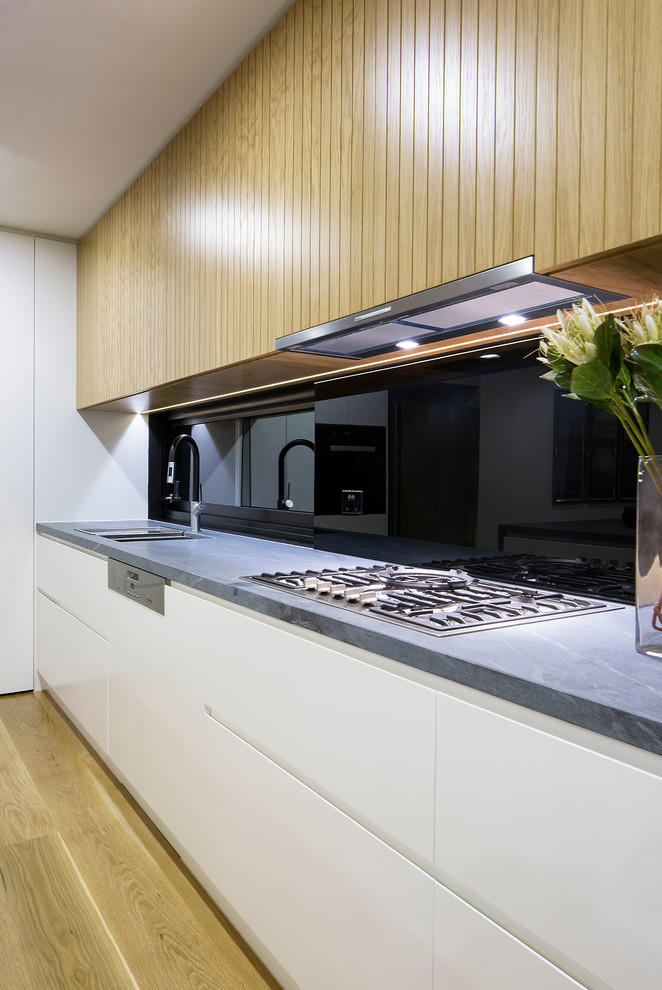 Photo of a contemporary l-shaped kitchen/diner in Melbourne with an island.
