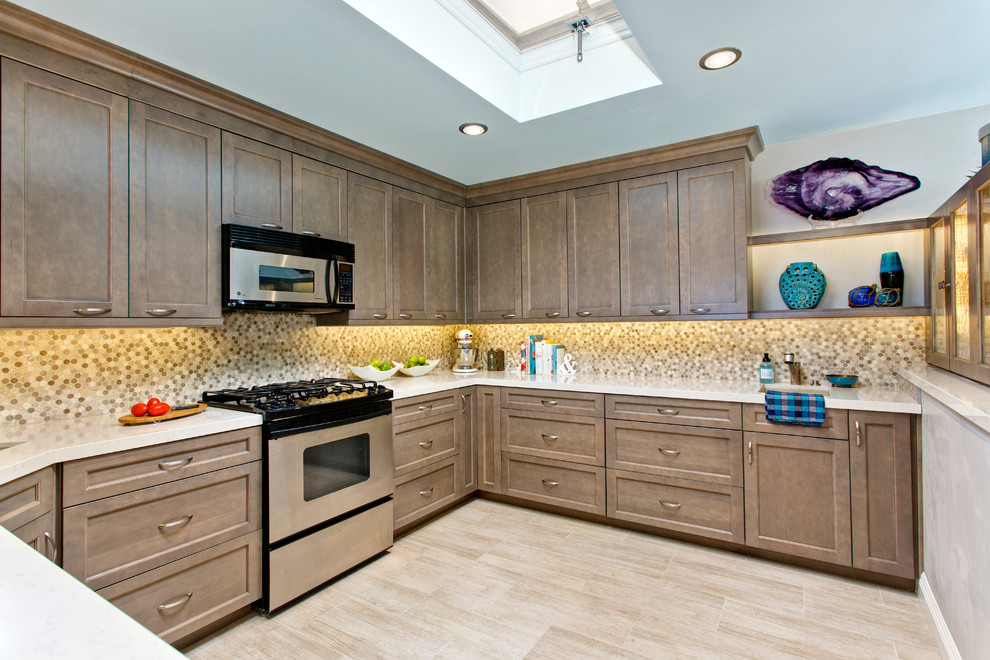 Kitchen - mid-sized coastal u-shaped porcelain tile kitchen idea in San Diego with an undermount sink, recessed-panel cabinets, gray cabinets, quartz countertops, multicolored backsplash, mosaic tile backsplash and stainless steel appliances