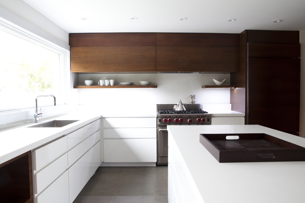 Contemporary kitchen in Toronto with integrated appliances.