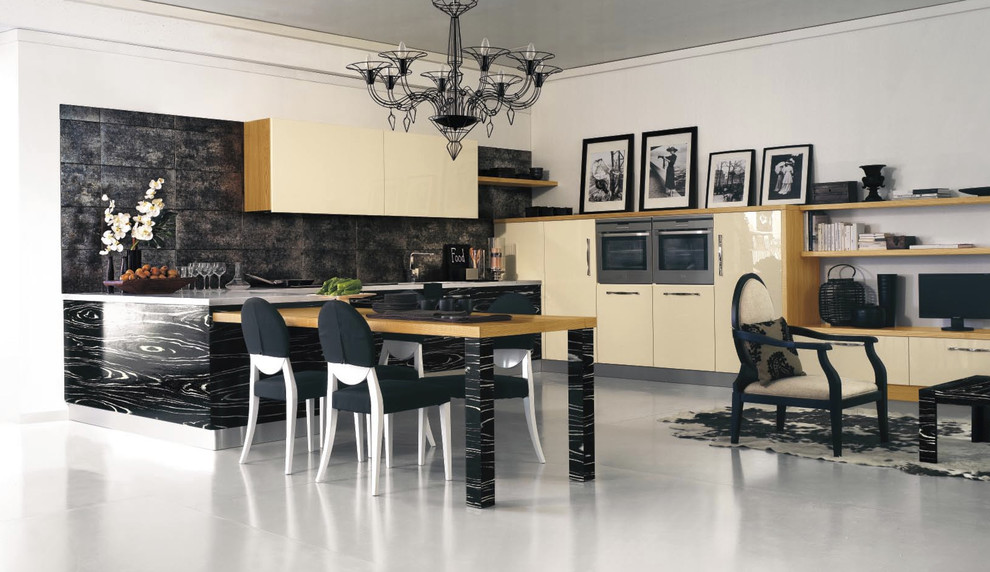 Photo of a contemporary kitchen in London with flat-panel cabinets, beige cabinets and black splashback.