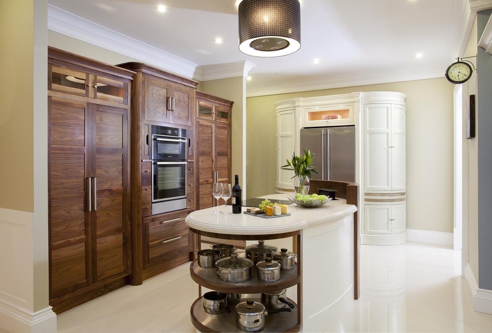 This is an example of a contemporary kitchen in Other with recessed-panel cabinets and dark wood cabinets.