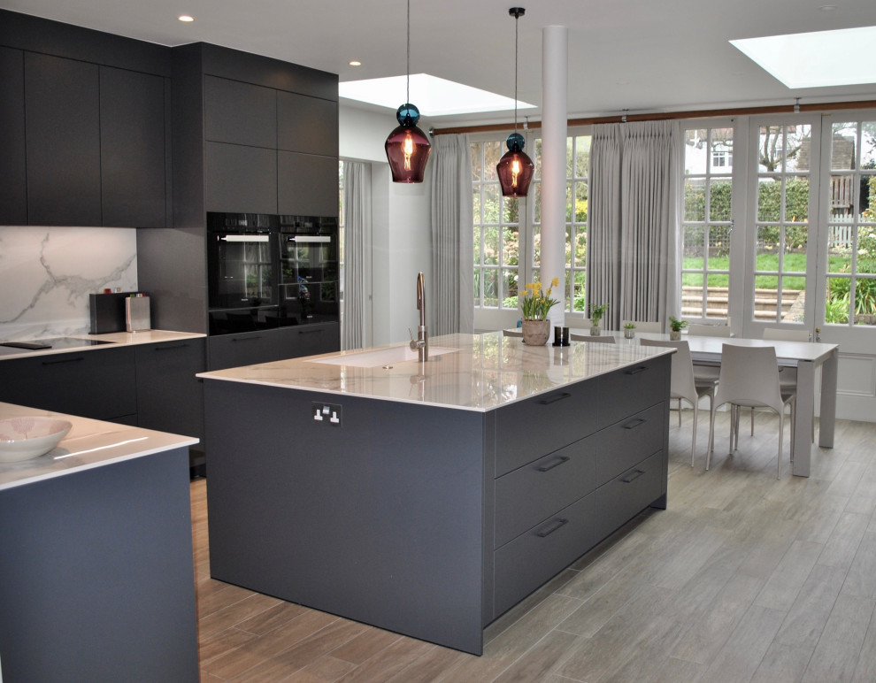 Modern and an elegant kitchen in dark grey with stunning worktop ...