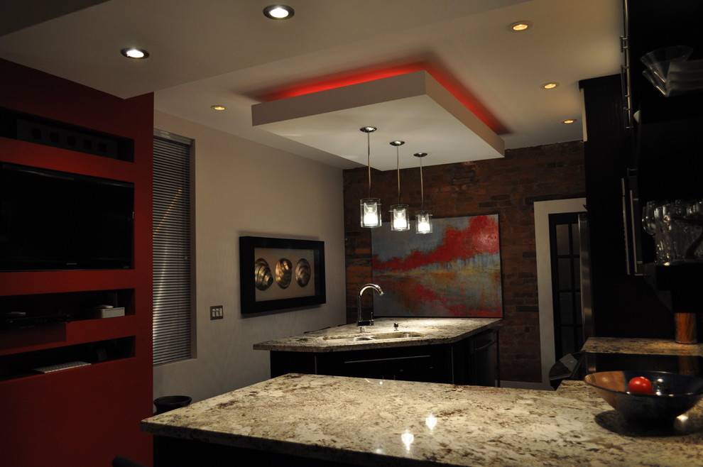 This is an example of a modern kitchen in Toronto with a feature wall.