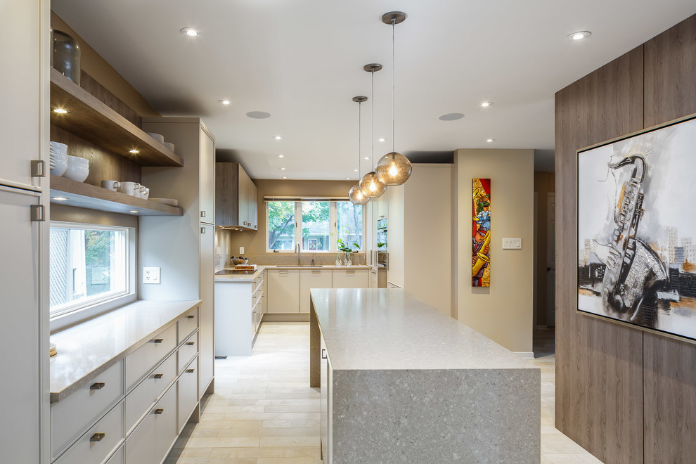 Mid-sized trendy u-shaped enclosed kitchen photo in Ottawa with flat-panel cabinets, beige cabinets, porcelain backsplash, paneled appliances and an island