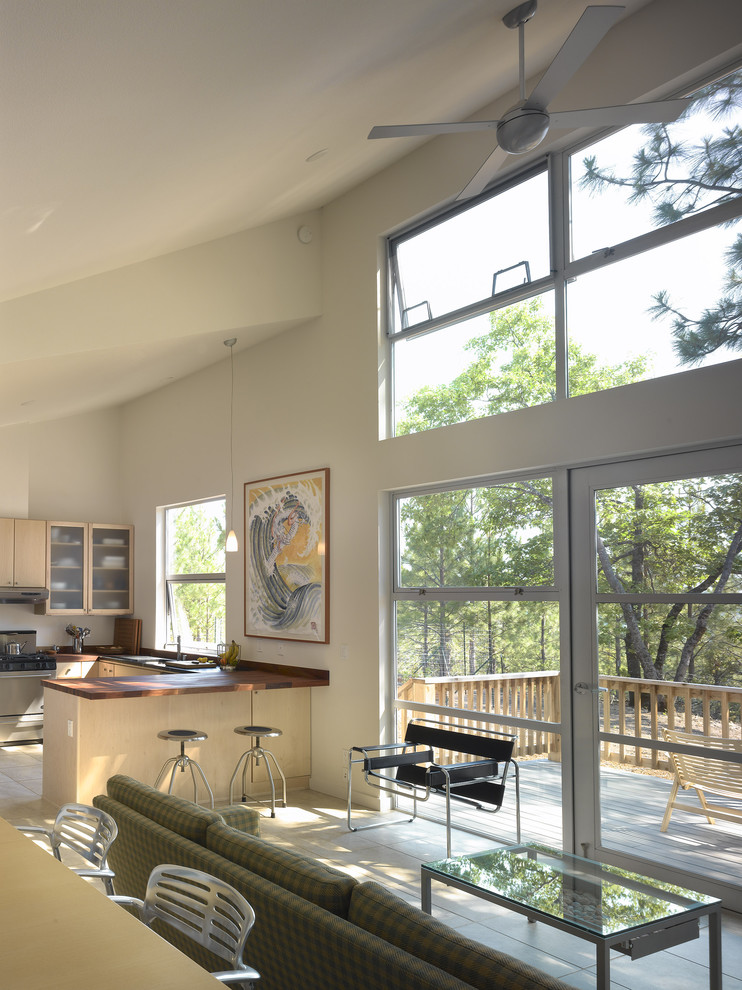 Photo of a retro open plan kitchen in San Francisco with flat-panel cabinets and light wood cabinets.