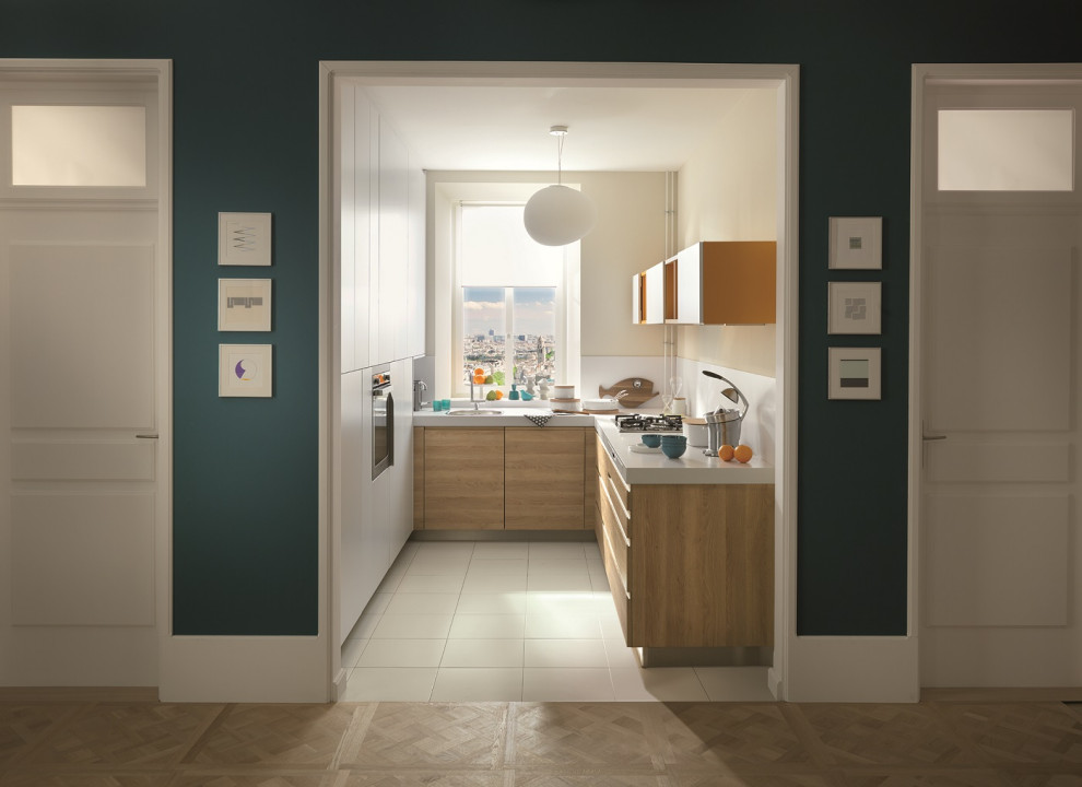 Inspiration for a small contemporary galley enclosed kitchen in Hertfordshire with flat-panel cabinets and no island.