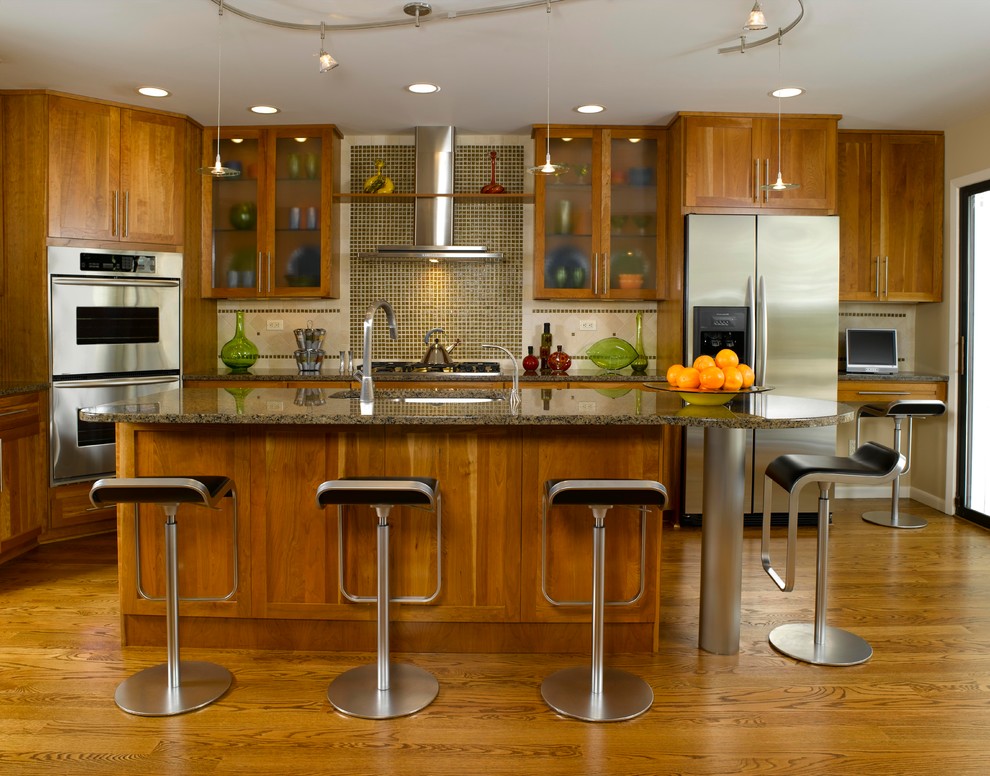 Immagine di una cucina design con lavello sottopiano, ante in stile shaker, ante in legno scuro, paraspruzzi verde, paraspruzzi con piastrelle a mosaico e elettrodomestici in acciaio inossidabile