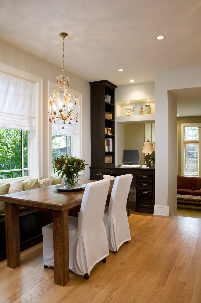 Example of a large classic light wood floor kitchen/dining room combo design in Chicago with white walls