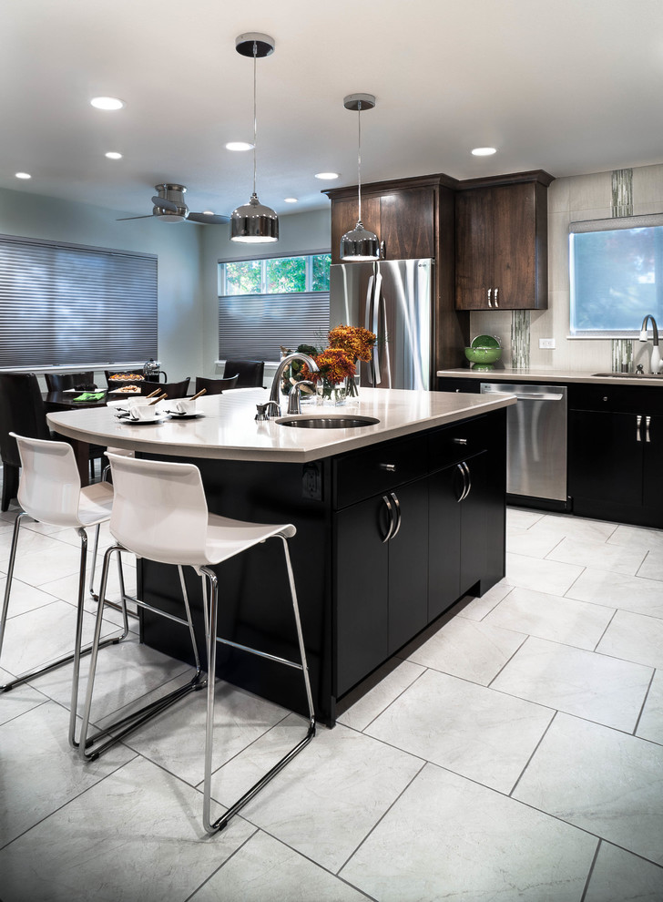 Inspiration for a mid-sized modern l-shaped porcelain tile eat-in kitchen remodel in San Francisco with an undermount sink, flat-panel cabinets, medium tone wood cabinets, quartz countertops, green backsplash, glass tile backsplash, stainless steel appliances and an island