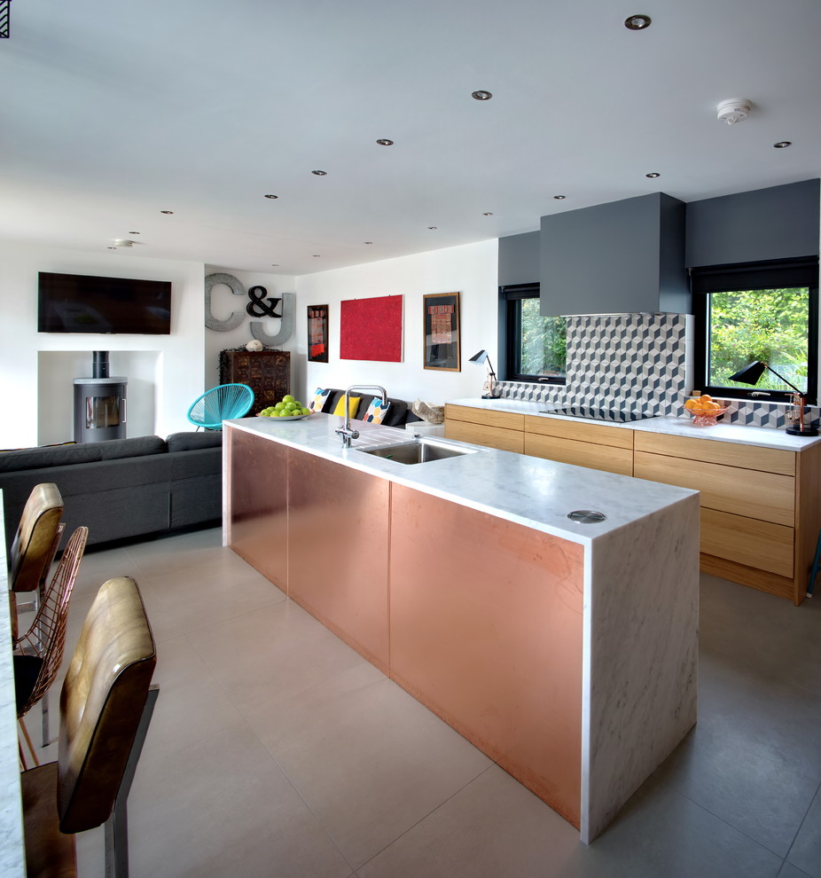 Large contemporary l-shaped open plan kitchen in Other with a single-bowl sink, flat-panel cabinets, medium wood cabinets, composite countertops, multi-coloured splashback, ceramic splashback, stainless steel appliances, ceramic flooring and an island.
