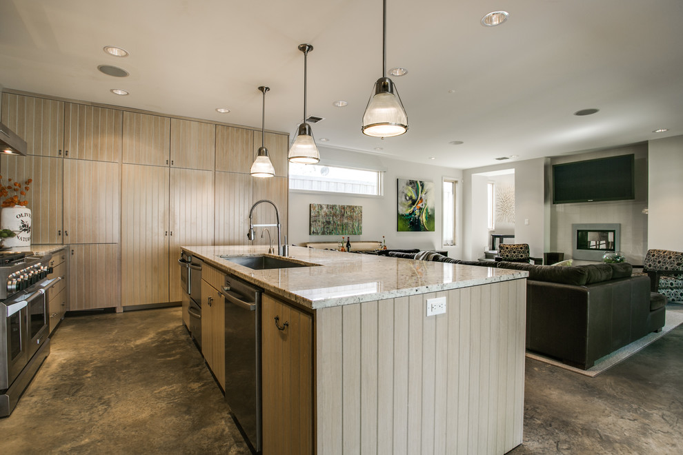 Design ideas for a farmhouse galley open plan kitchen in Dallas with a submerged sink, flat-panel cabinets, light wood cabinets, stainless steel appliances, concrete flooring and an island.