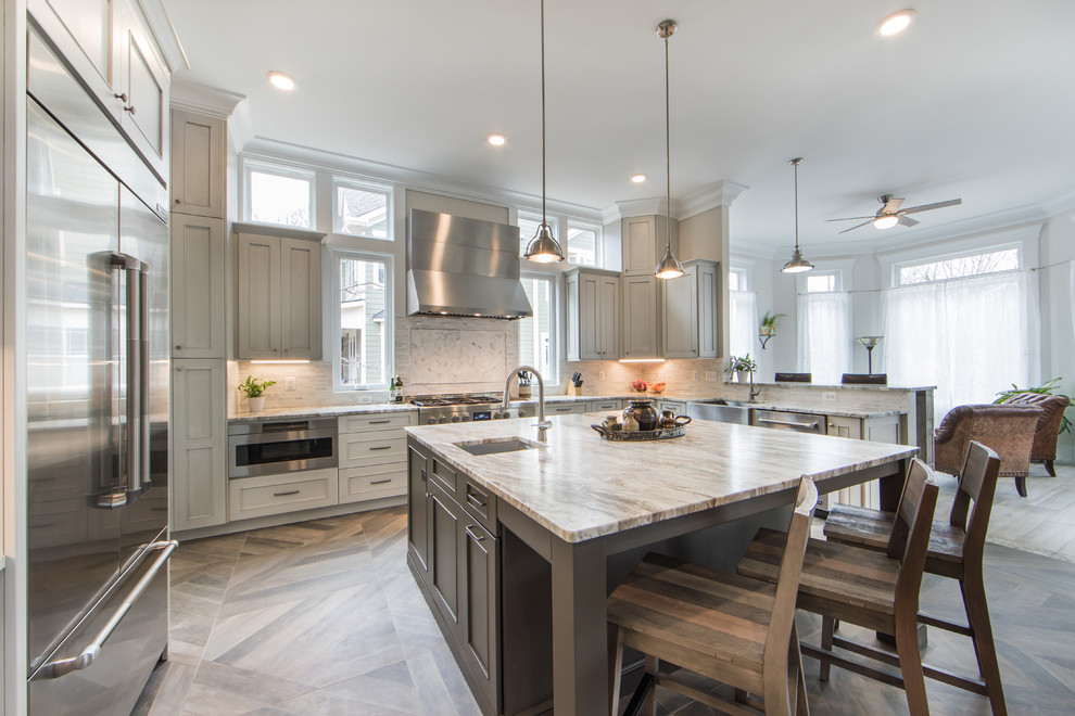 This is an example of a large farmhouse u-shaped open plan kitchen in DC Metro with a belfast sink, shaker cabinets, grey cabinets, granite worktops, grey splashback, ceramic splashback, stainless steel appliances, ceramic flooring, an island, grey floors and grey worktops.