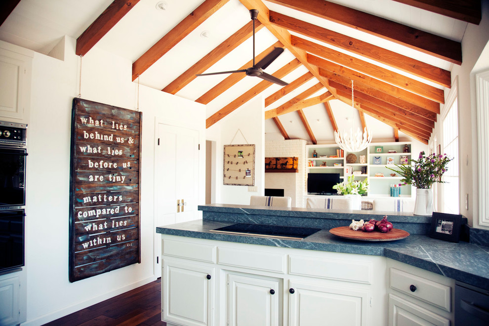 Inspiration for a farmhouse kitchen in San Francisco with raised-panel cabinets, white cabinets, dark hardwood flooring and blue worktops.