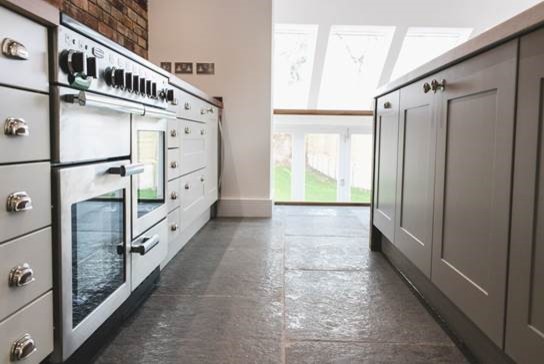 Inspiration for a modern kitchen in Other with limestone flooring.