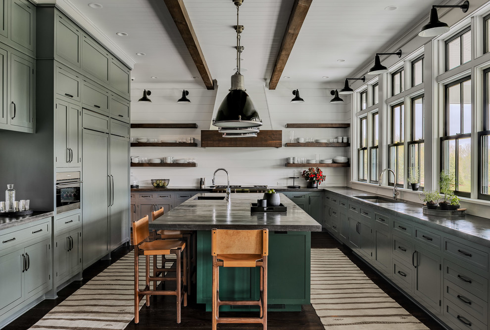 Photo of a large farmhouse kitchen in New York with an island, shaker cabinets, grey cabinets, concrete worktops, white splashback, wood splashback, stainless steel appliances, dark hardwood flooring, a submerged sink and grey worktops.