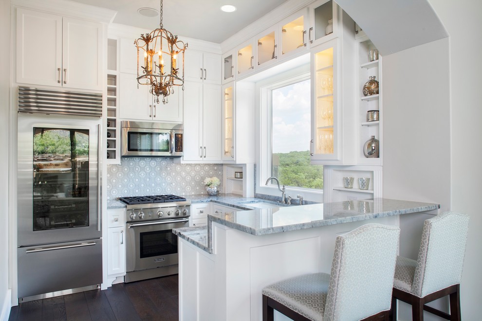 Kitchen - small traditional u-shaped dark wood floor kitchen idea in Austin with an undermount sink, white cabinets, multicolored backsplash, stainless steel appliances, a peninsula and recessed-panel cabinets