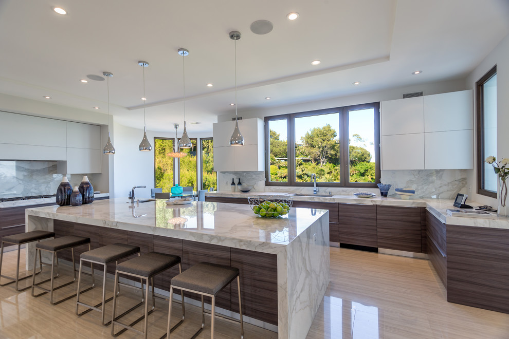 Eat-in kitchen - contemporary porcelain tile eat-in kitchen idea in Los Angeles with a single-bowl sink, flat-panel cabinets, brown cabinets, marble countertops, multicolored backsplash, stone slab backsplash, white appliances and an island