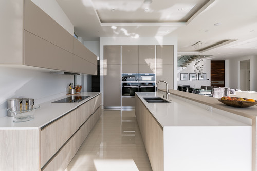 Minimalist Canadian kitchen with beige and light wood cabinets — showcasing one of the best kitchen cabinet colors Canada homeowners choose for a sleek and modern look.