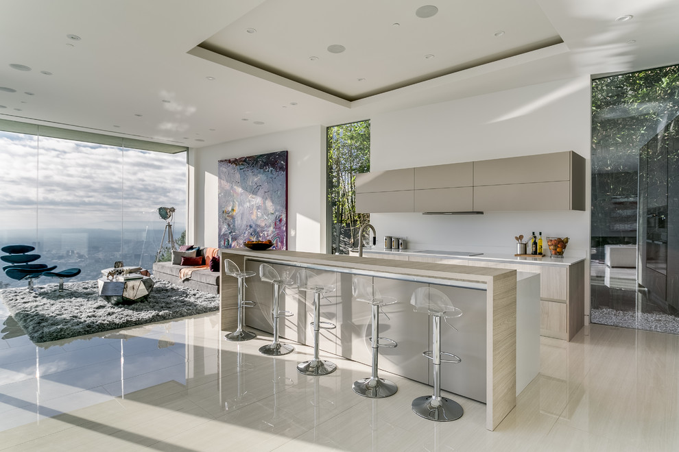 Mid-sized minimalist l-shaped ceramic tile open concept kitchen photo in Los Angeles with a double-bowl sink, flat-panel cabinets, beige cabinets, quartz countertops, white backsplash, stainless steel appliances and an island