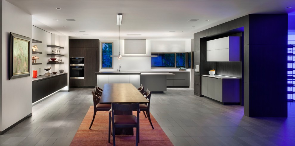 Design ideas for a modern kitchen in Denver with white cabinets, quartz worktops and dark hardwood flooring.