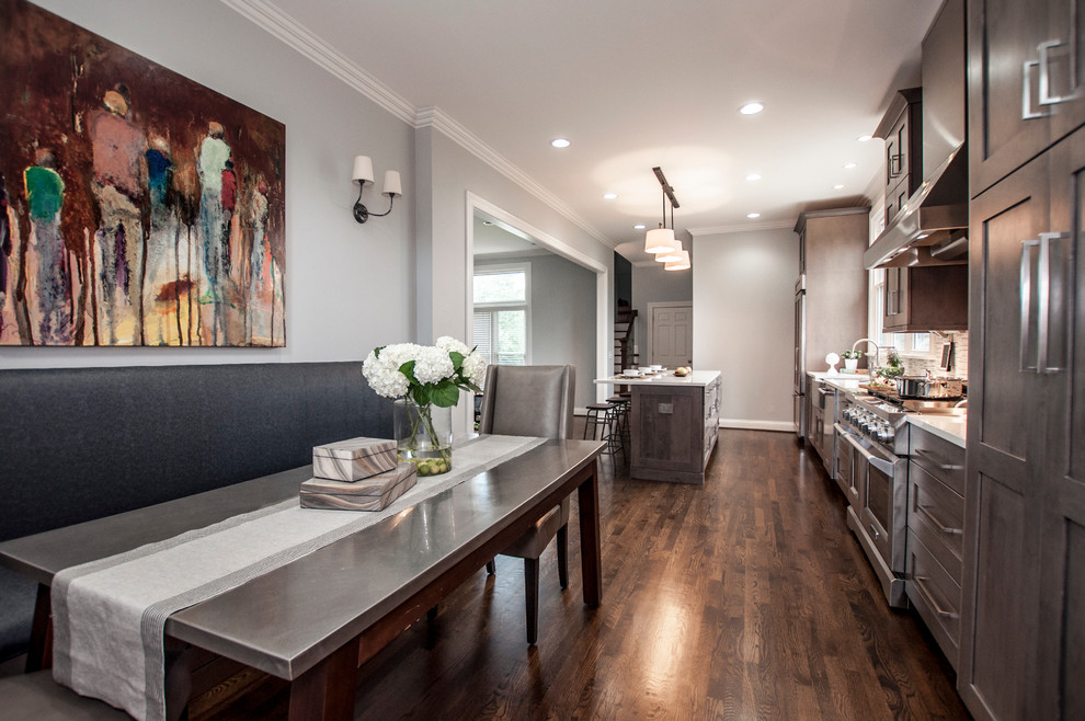 Inspiration for a large transitional single-wall dark wood floor and brown floor eat-in kitchen remodel in Nashville with a farmhouse sink, shaker cabinets, gray cabinets, quartz countertops, white backsplash, mosaic tile backsplash, stainless steel appliances, an island and white countertops
